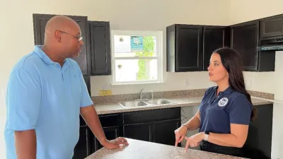 Habitat for Humanity of Jacksonville, Florida, Vice President Octavious Carr talks with CBP’s Amelia Castelli.