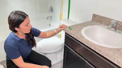CBP’s Amelia Castelli looks at how the donated plywood was used to build a bathroom sink countertop in a Habitat for Humanity home in Jacksonville, Florida.